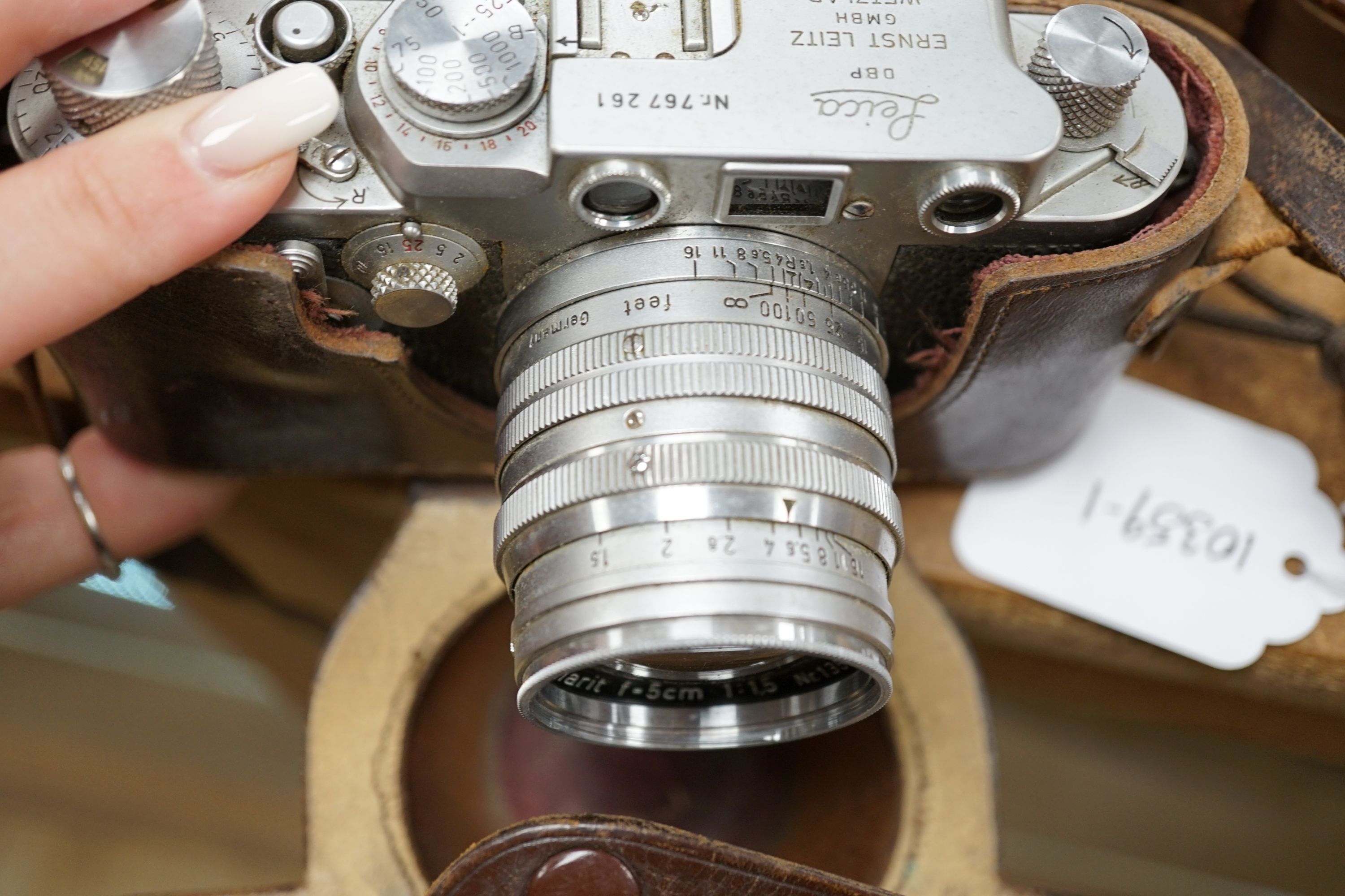 A cased Leica III camera serial number 767261 with Ernst Leitz GmbH Wetzlar Summarit f=5cm 1:15 No.135729 lens and light exposure meter